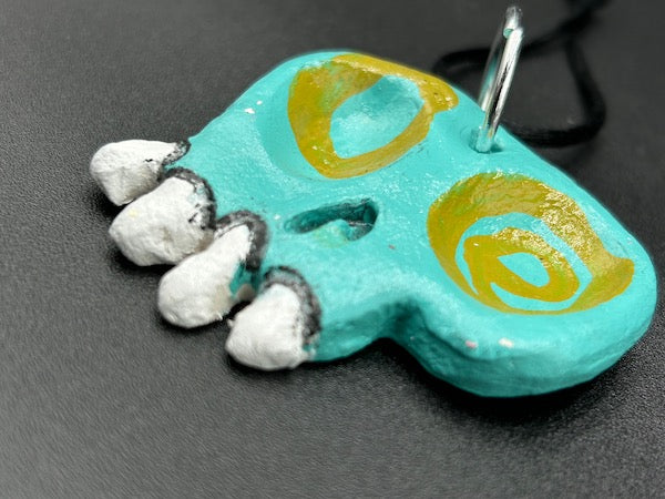 CLAY SKULL ORNAMENT